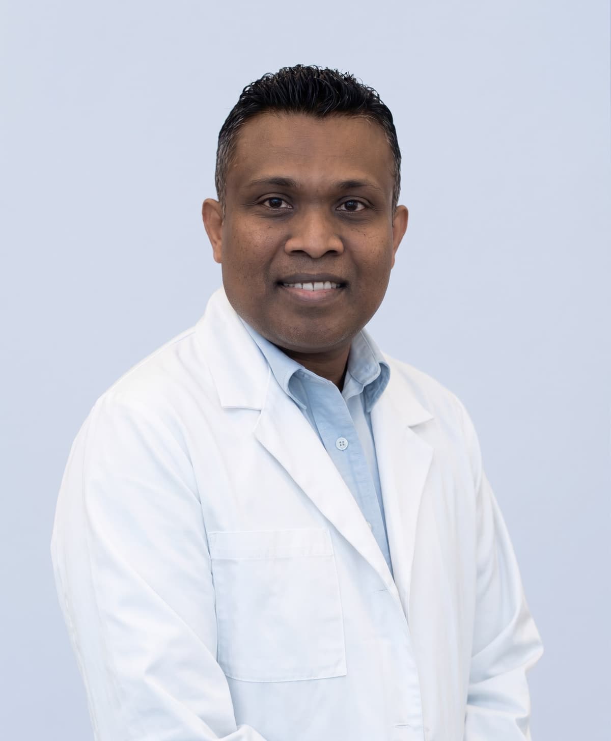 Dr. Savinda Morais, ND in lab coat - Naturopathic Doctor Hamilton