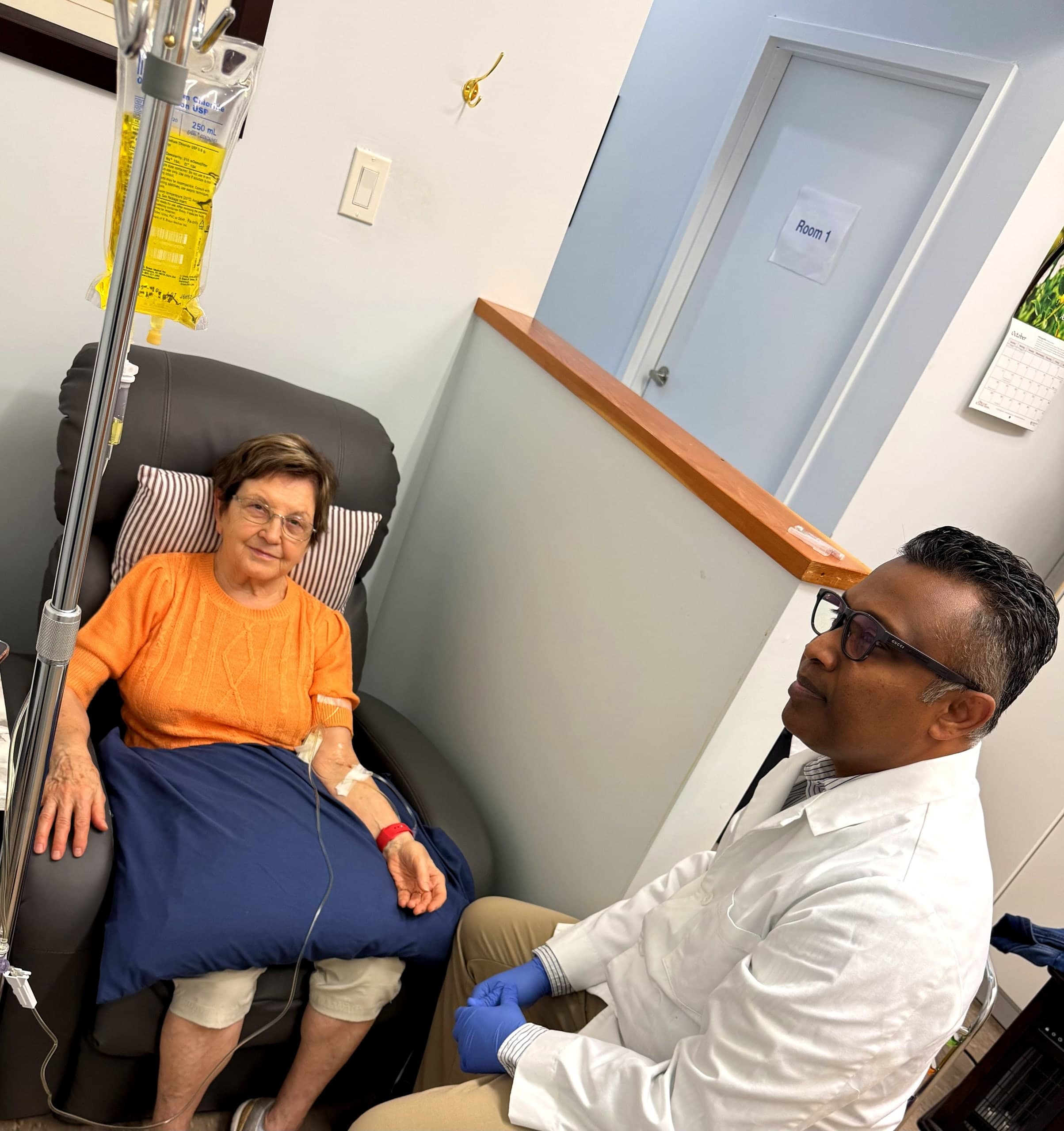 Dr. Savinda Morais, ND consulting with an IV therapy patient in Hamilton clinic