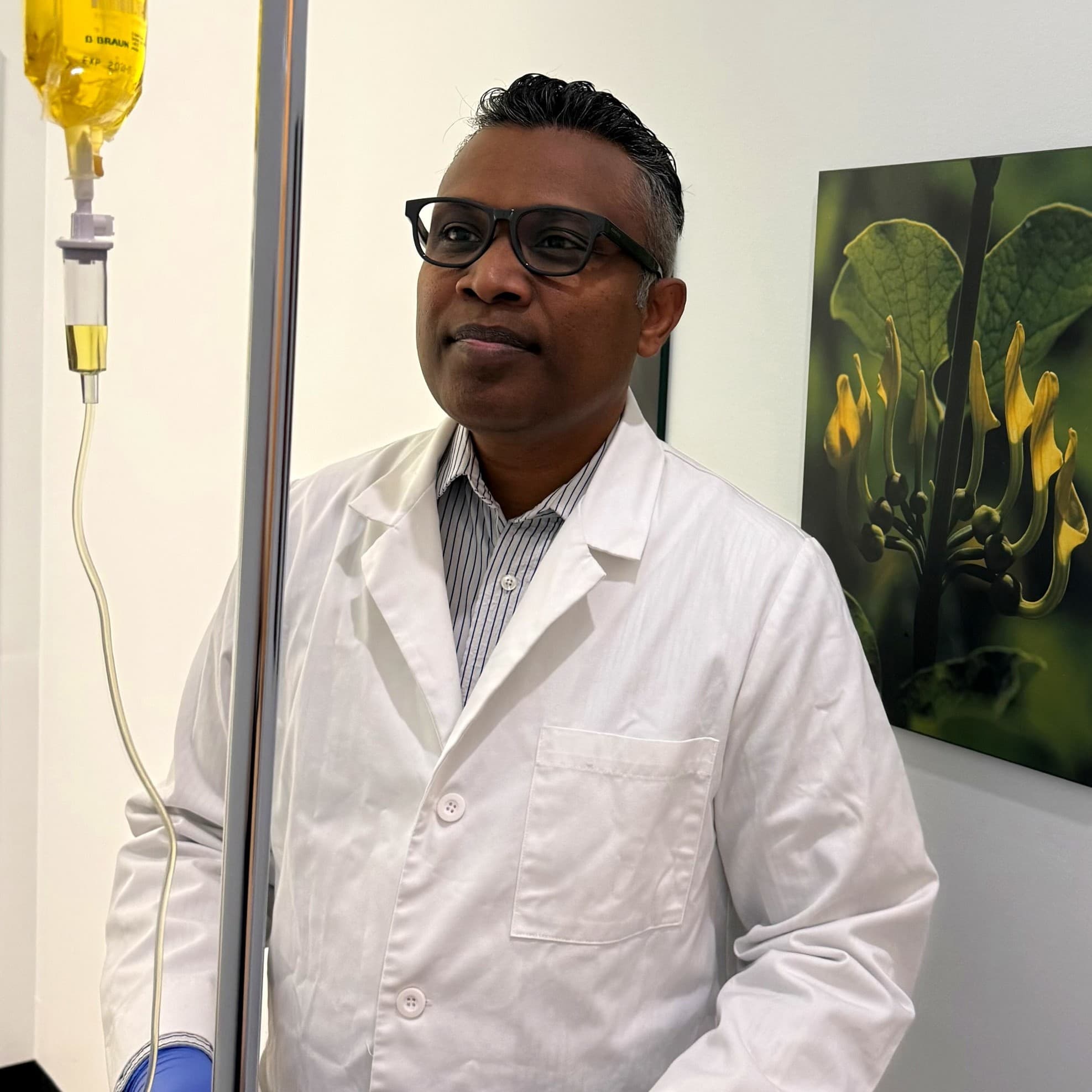 Dr. Savinda Morais, ND preparing IV infusion setup at Hamilton clinic