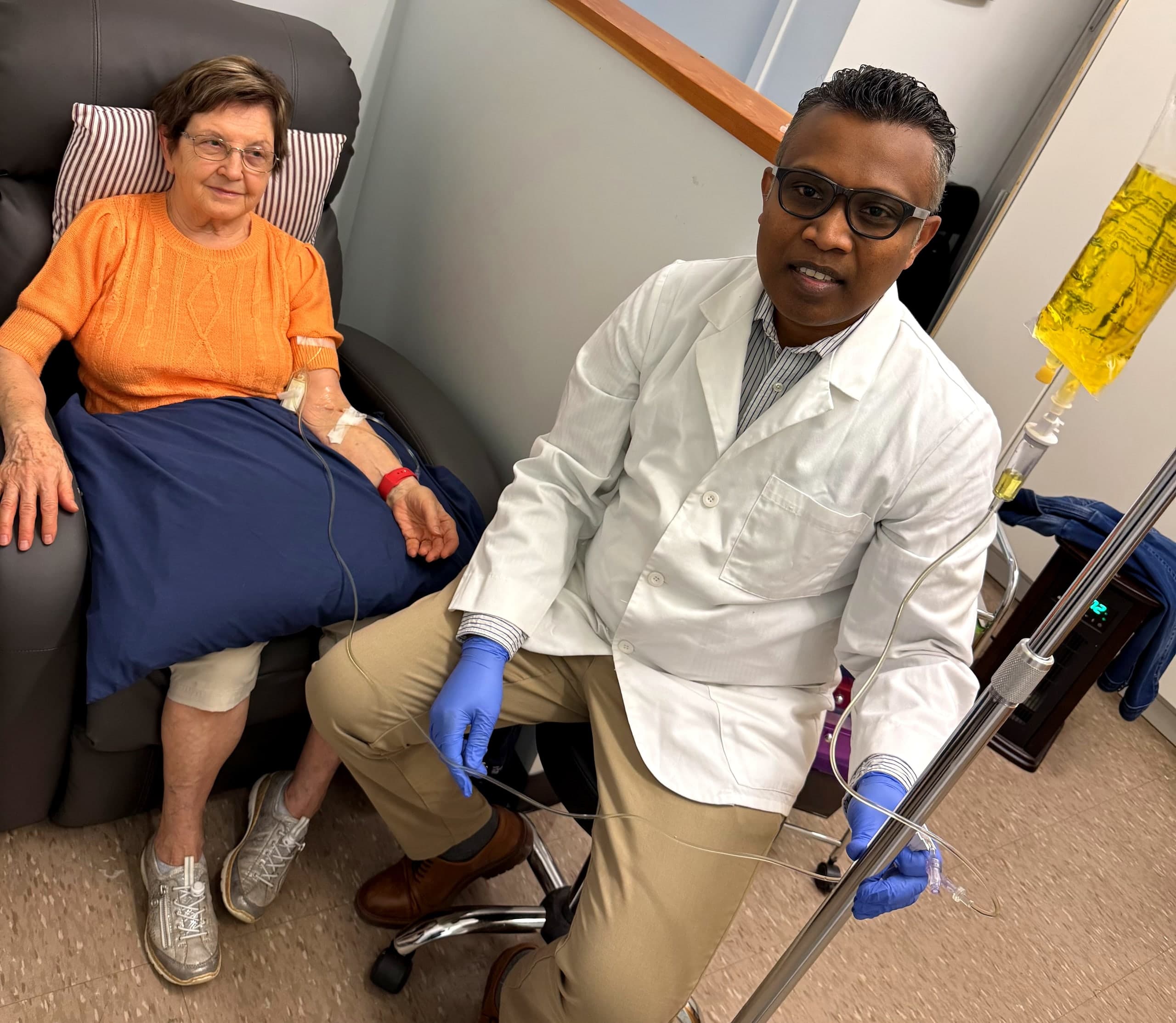 Dr. Morais with patient during IV therapy session in Hamilton
